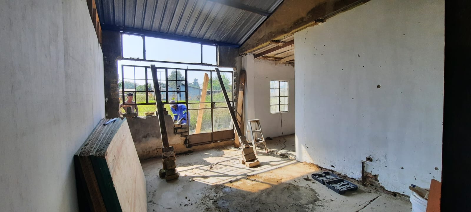 Opening widened and prepared for new door/window